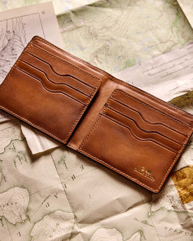 flatlay of the inner pockets on The Minimalist Billfold Wallet in Black, Accessories by Taylor Stitch