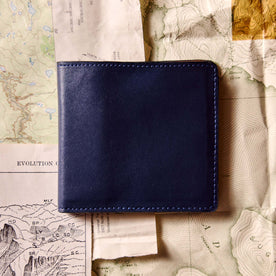 editorial flatlay of The Minimalist Billfold Wallet in Navy