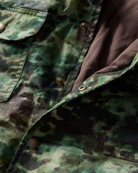 material shot of the snap buttons on The Venture Jacket in Painted Camo Waxed Canvas, Outerwear by Taylor Stitch