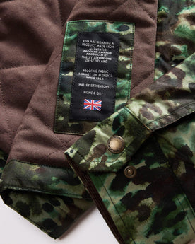 material shot of the Halley Stevensons material patch on The Venture Jacket in Painted Camo Waxed Canvas, Outerwear by Taylor Stitch