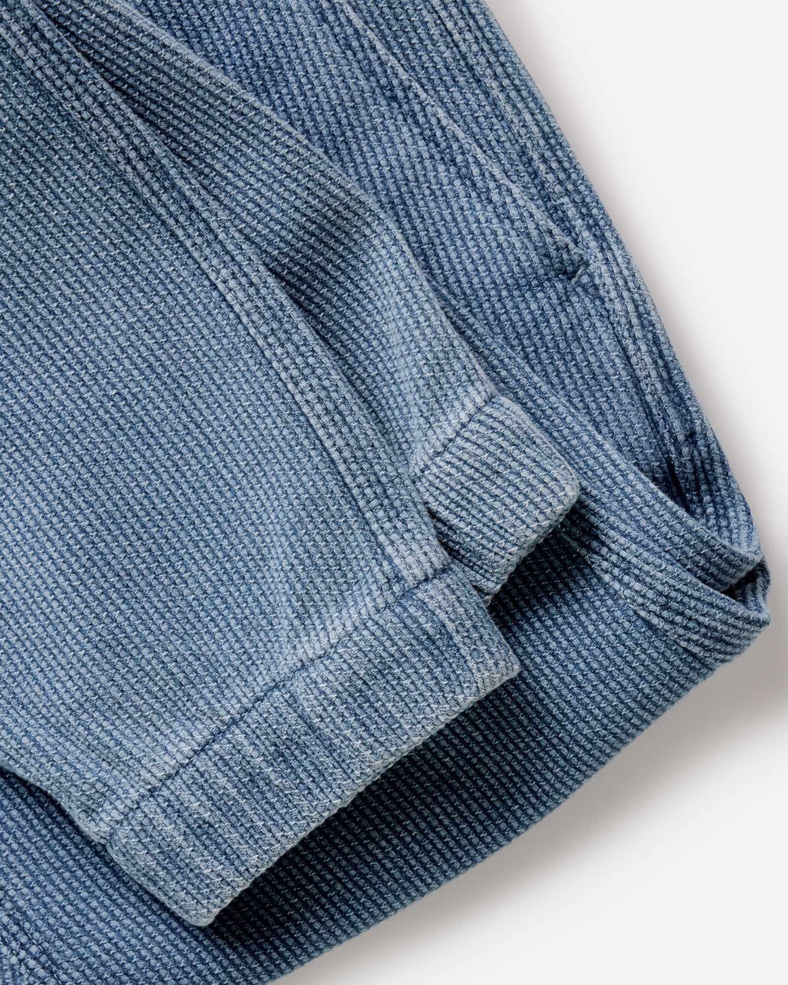 folded flatlay of the back of The Apres Pant in Washed Indigo Sashiko, Bottoms by Taylor Stitch