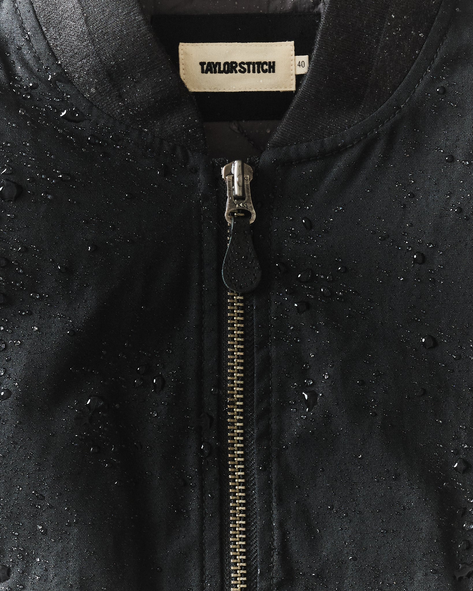 fit model showing the back of The Insulated Bomber Jacket in Coal Dry Wax, Outerwear by Taylor Stitch