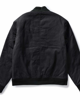 flatlay of The Insulated Bomber Jacket in Coal Dry Wax, shown from the back, Outerwear by Taylor Stitch