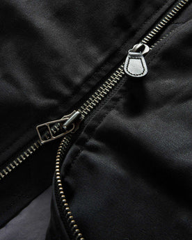 material shot of the two-way YKK zipper on The Insulated Bomber Jacket in Coal Dry Wax, Outerwear by Taylor Stitch