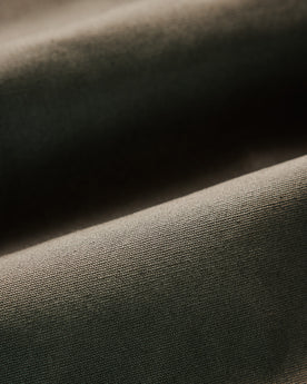 material shot of the ribbed neck opening on The Insulated Bomber Jacket in Fatigue Olive Dry Wax, Outerwear by Taylor Stitch