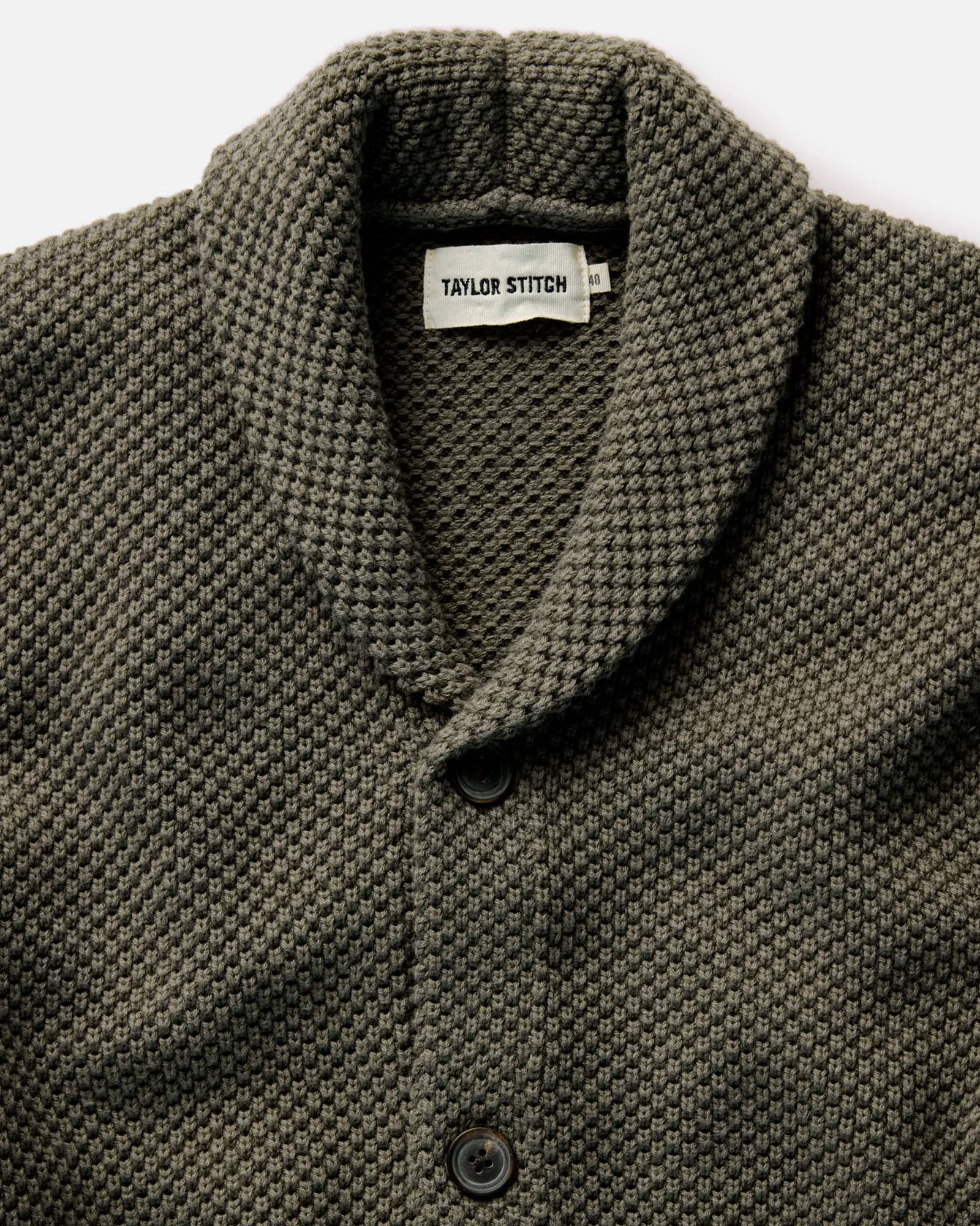 material shot of the pocket and cuff on The Crawford Sweater in Fatigue Olive, Knits by Taylor Stitch