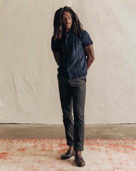 fit model with his hand in his pocket wearing The Democratic Foundation Pant in Organic Faded Black, Bottoms by Taylor Stitch