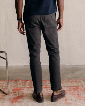 fit model posing in The Democratic Foundation Pant in Organic Faded Black, Bottoms by Taylor Stitch
