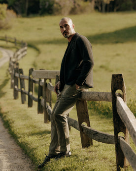 fit model posing in The Democratic Foundation Pant in Organic Smoked Olive, Bottoms by Taylor Stitch
