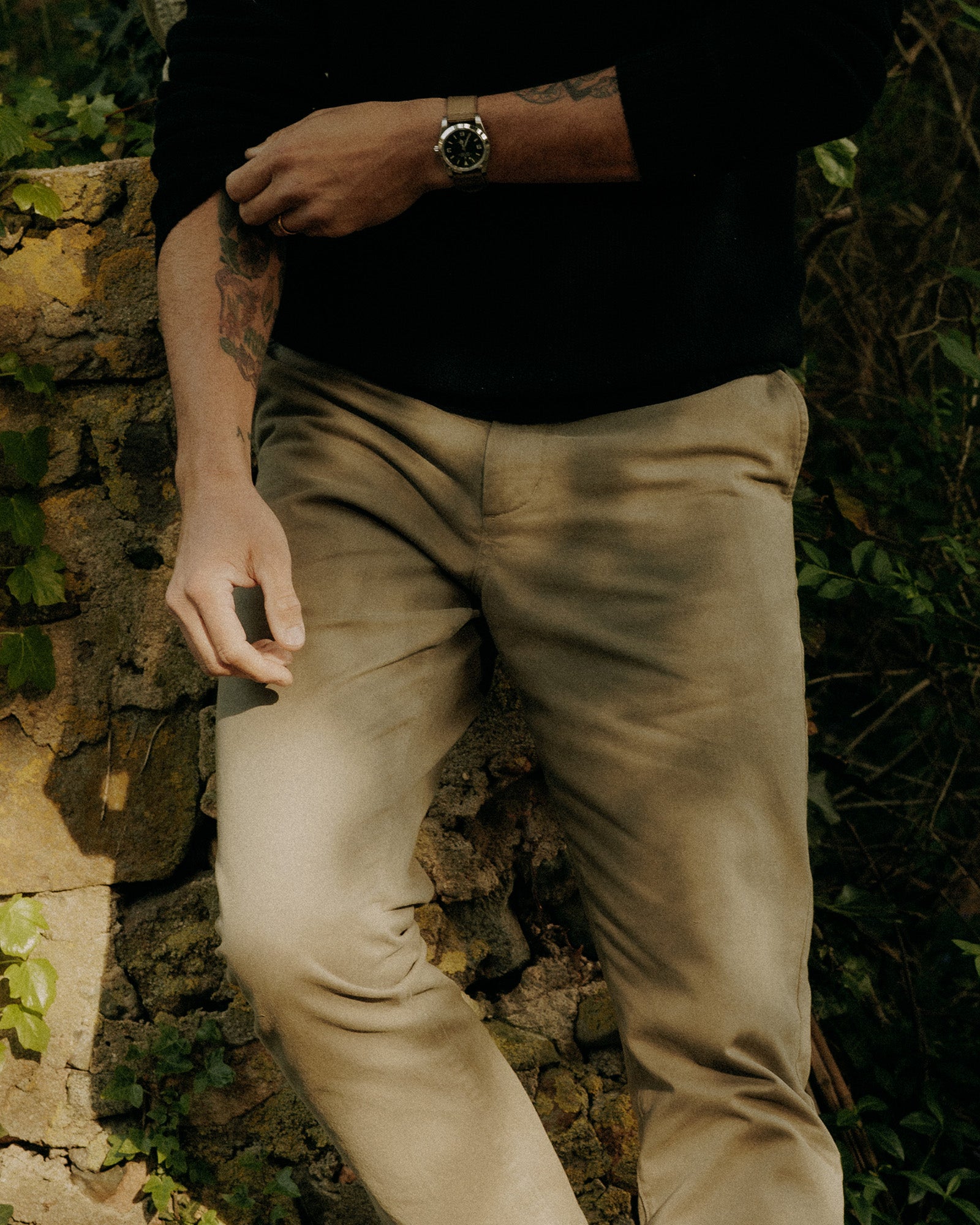 fit model showing off the back of The Democratic Foundation Pant in Organic Smoked Olive, Bottoms by Taylor Stitch