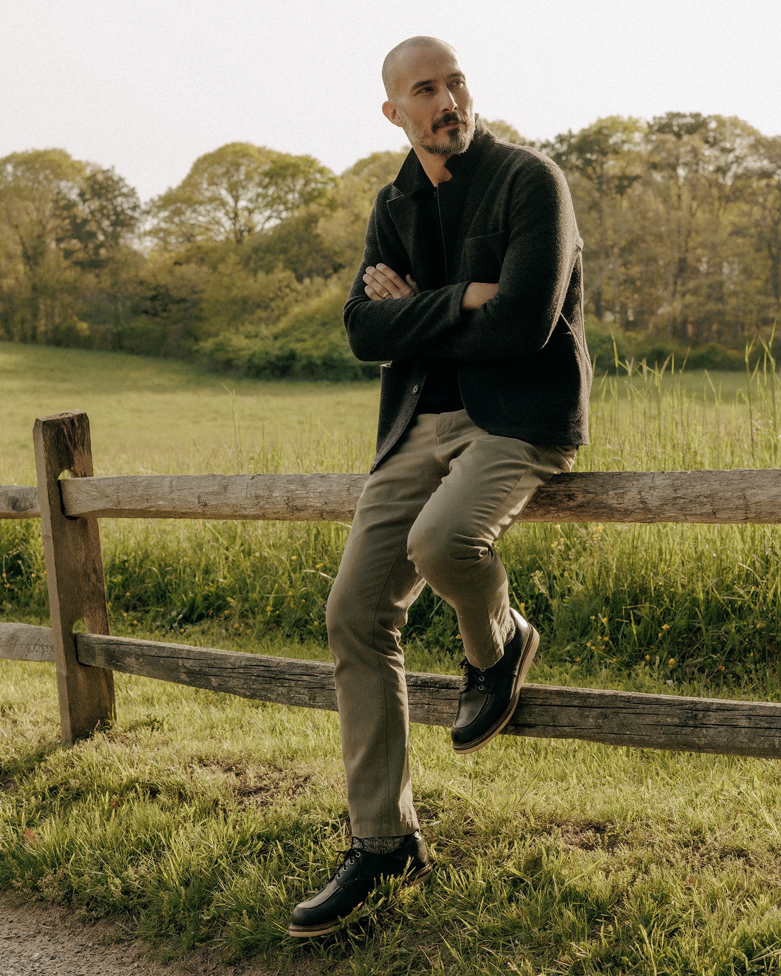 fit model with his hand in his pocket wearing The Democratic Foundation Pant in Organic Smoked Olive, Bottoms by Taylor Stitch