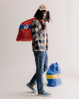 fit model walking wearing The Democratic Jean in Mid Wash Organic Selvedge, Bottoms by Taylor Stitch