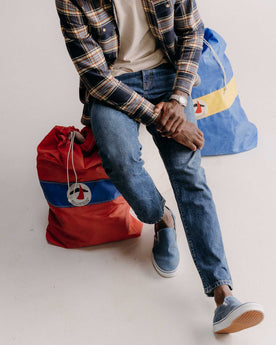 fit model posing in The Democratic Jean in Mid Wash Organic Selvedge, Bottoms by Taylor Stitch