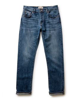 flatlay of The Democratic Jean in Mid Wash Organic Selvedge, Bottoms by Taylor Stitch
