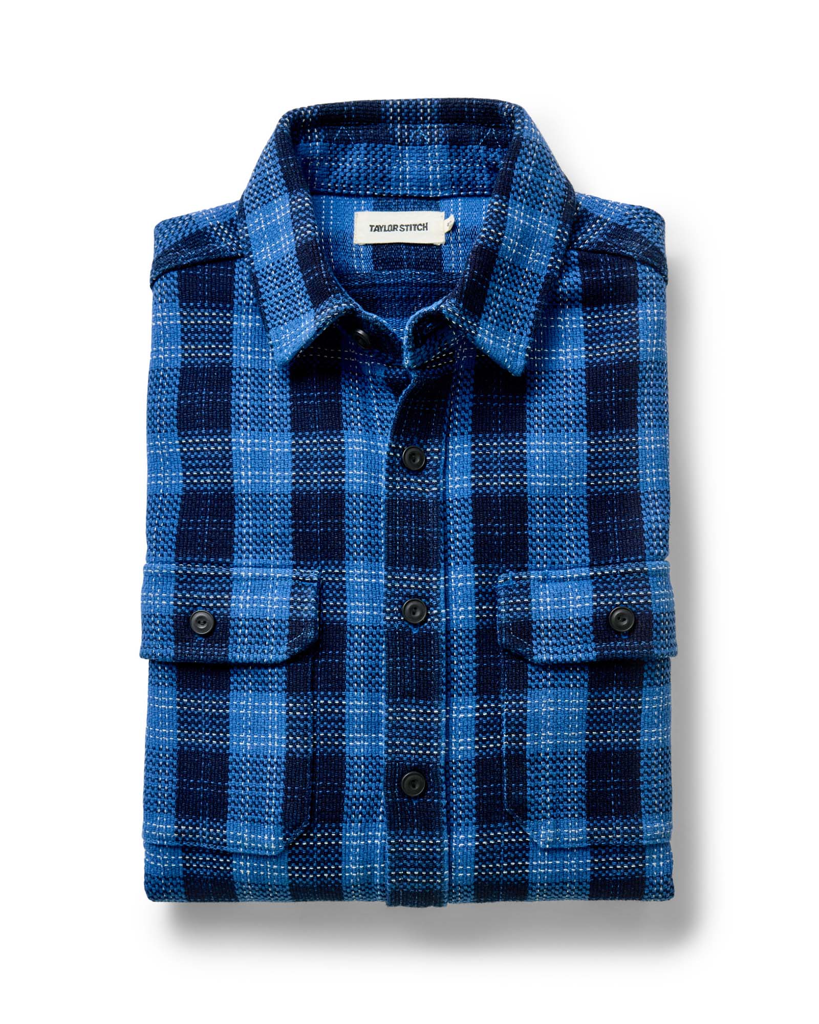 folded flatlay of The Division Shirt in Rinsed Indigo Plaid, Wovens by Taylor Stitch