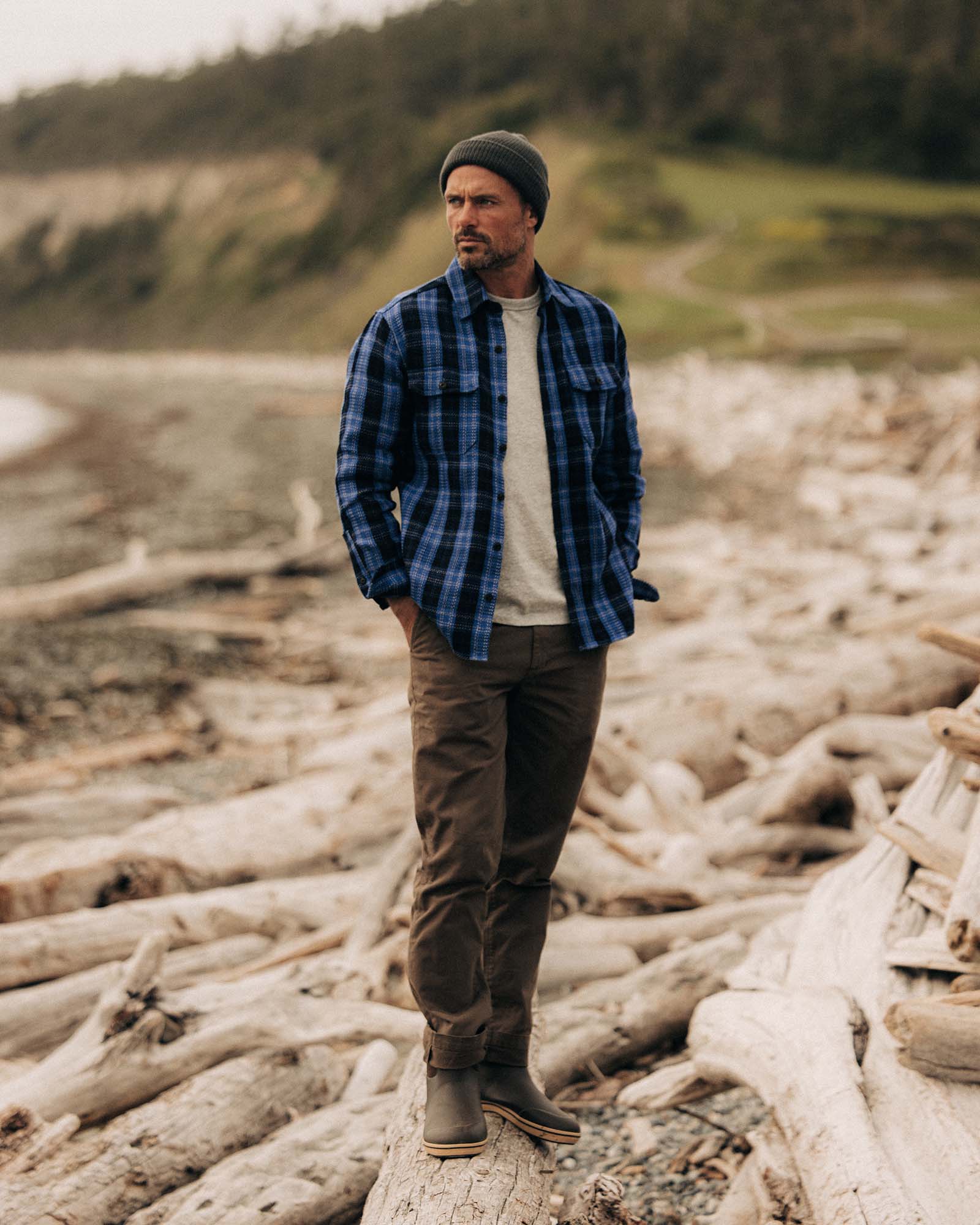 fit model posing in The Division Shirt in Rinsed Indigo Plaid, Wovens by Taylor Stitch