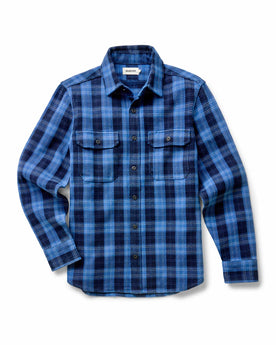 fit model holding a log wearing The Division Shirt in Rinsed Indigo Plaid, Wovens by Taylor Stitch