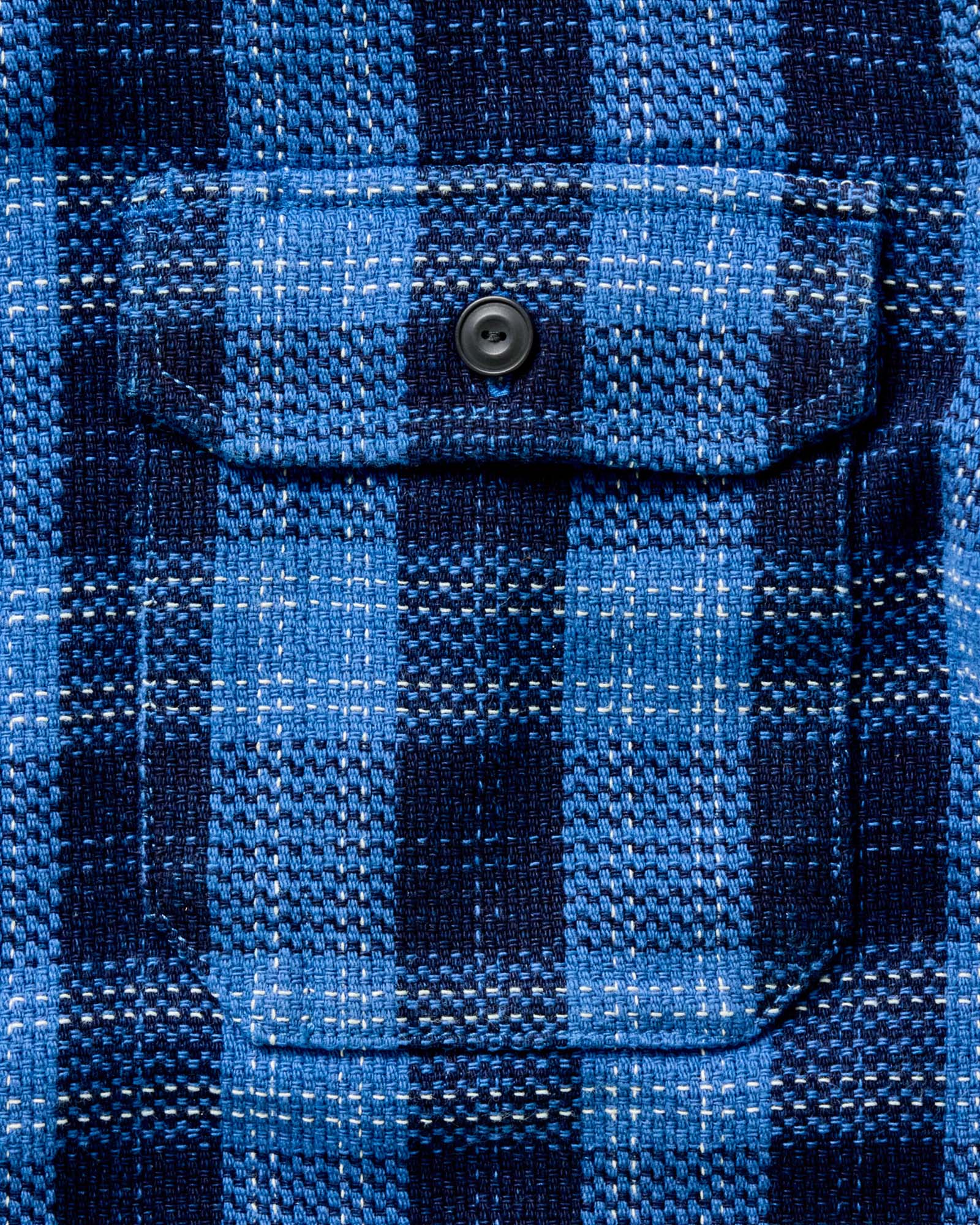 material shot of the buttons on The Division Shirt in Rinsed Indigo Plaid, Wovens by Taylor Stitch