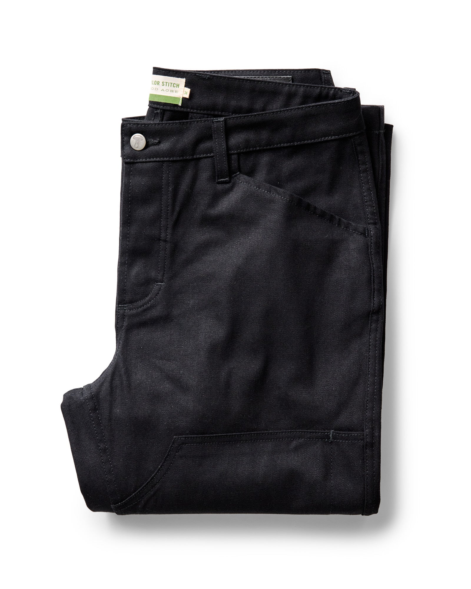 folded flatlay of The Good Acre Chore Pant in Black Canvas, Bottoms by Taylor Stitch