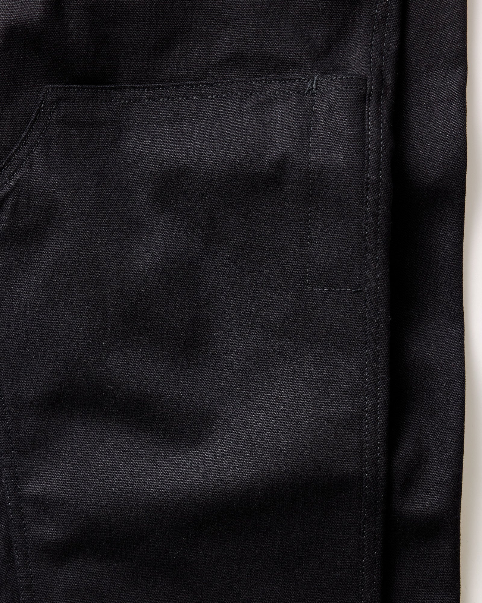 folded flatlay of the back of The Good Acre Chore Pant in Black Canvas, Bottoms by Taylor Stitch