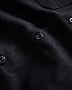 material shot of the buttons on The Good Acre Forge Overshirt in Black Canvas, Outerwear by Taylor Stitch