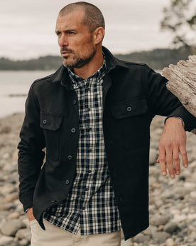 fit model leaning against a tree wearing The Jack in Rinsed Indigo Plaid, Wovens by Taylor Stitch