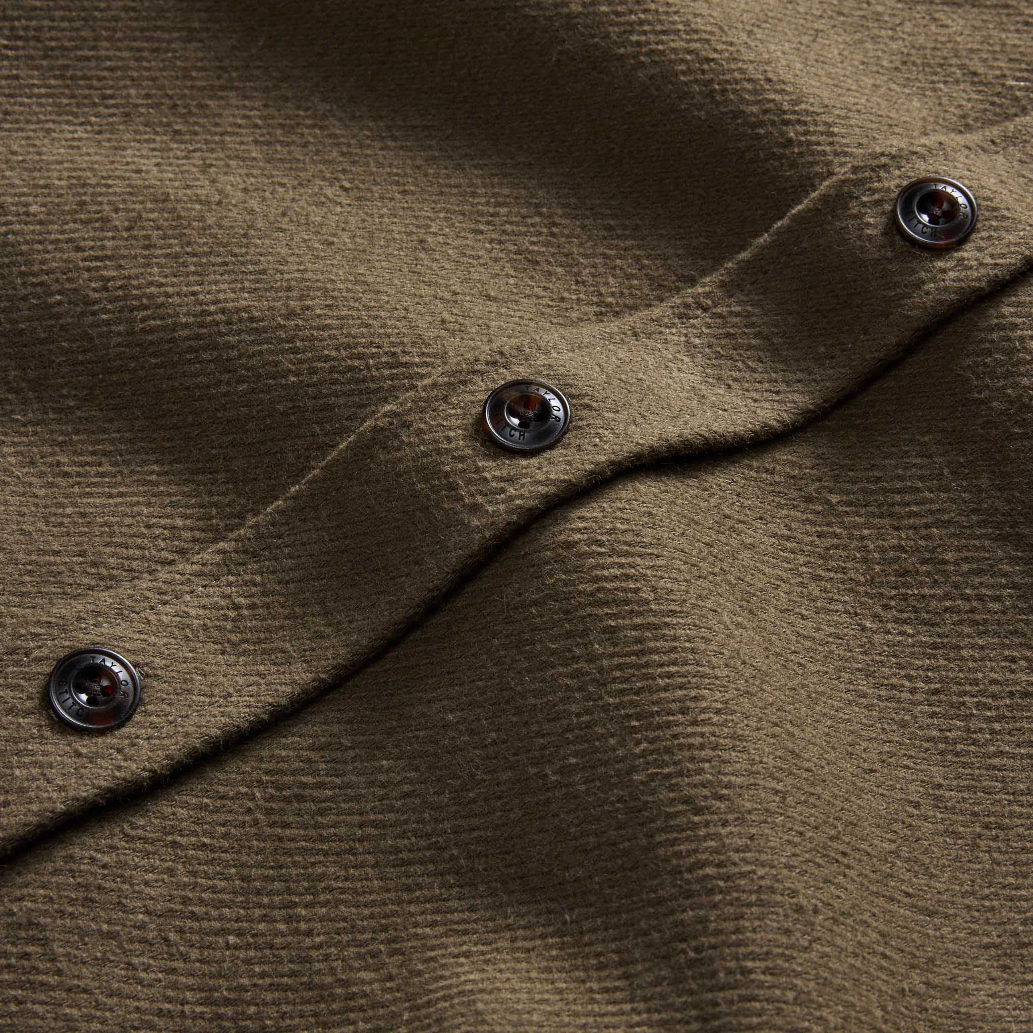 material shot of the buttons on The Maritime Shirt Jacket in Fatigue Olive Moleskin Twill, Outerwear by Taylor Stitch