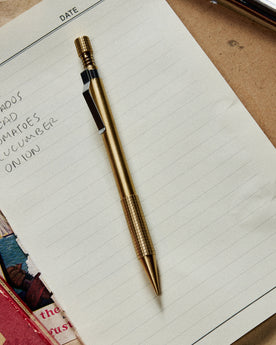 editorial image of The Mechanical Pencil in Brass on a sheet of paper, Accessories by Taylor Stitch