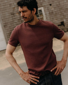 fit model posing in The Organic Cotton Short Sleeve Crew in Burgundy Waffle, Knits by Taylor Stitch