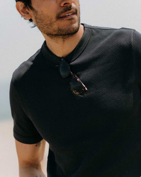 fit model with his arms crossed wearing The Organic Cotton Short Sleeve Crew in Dark Navy Waffle, Knits by Taylor Stitch