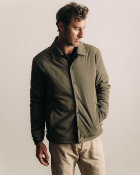 fit model walking wearing The Ridgeline Overshirt in Fatigue Olive, Wovens by Taylor Stitch