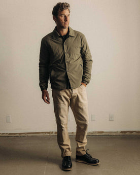 fit model showing off the buttons on The Ridgeline Overshirt in Fatigue Olive, Wovens by Taylor Stitch