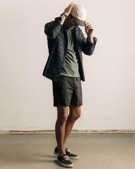 fit model walking wearing The Ridgeline Short in Coal, Bottoms by Taylor Stitch