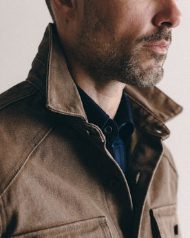 fit model showing off the collar on The Shop Shirt in Aged Penny Chipped Canvas, Wovens by Taylor Stitch
