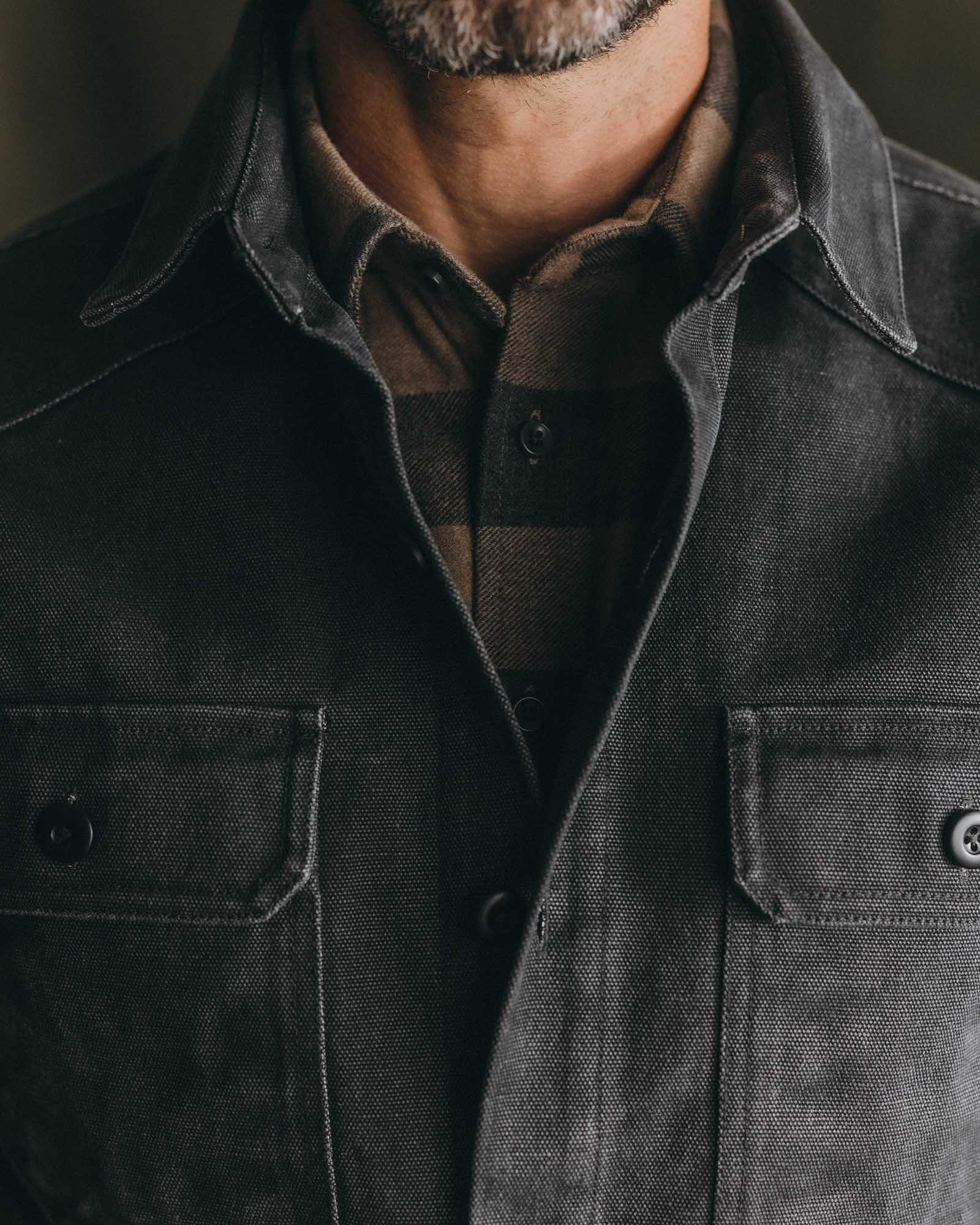 fit model posing in The Shop Shirt in Coal Chipped Canvas, Wovens by Taylor Stitch