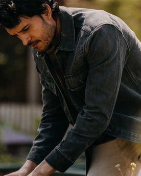 fit model posing in The Shop Shirt in Coal Chipped Canvas, Wovens by Taylor Stitch