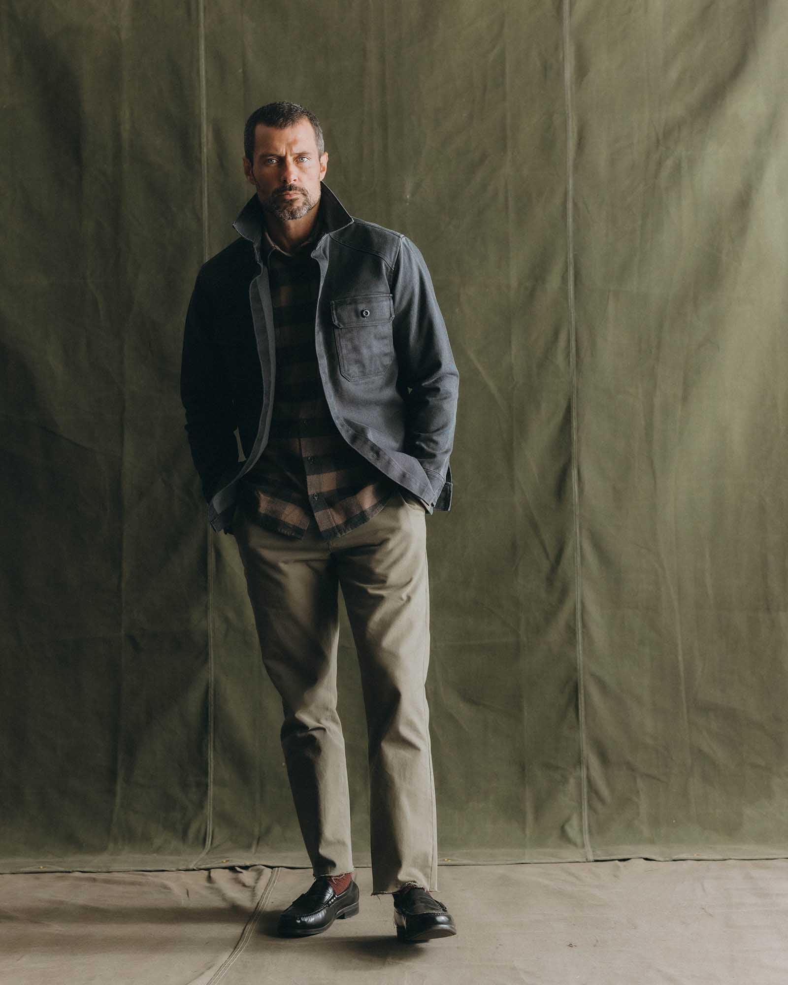 fit model holding planters wearing The Shop Shirt in Coal Chipped Canvas, Wovens by Taylor Stitch