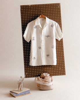 editorial image of The Short Sleeve Davis Shirt in Embroidered Natural hanging, Wovens by Taylor Stitch