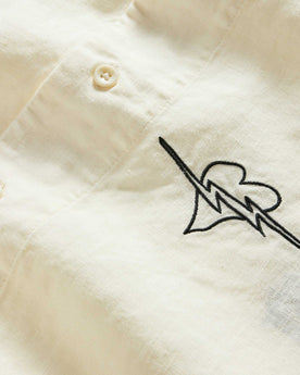 material shot of the buttons on The Short Sleeve Davis Shirt in Embroidered Natural, Wovens by Taylor Stitch