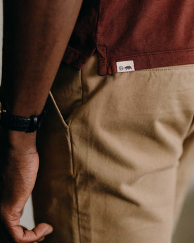 fit model posing in The Slim Foundation Pant in Organic Khaki, Bottoms by Taylor Stitch