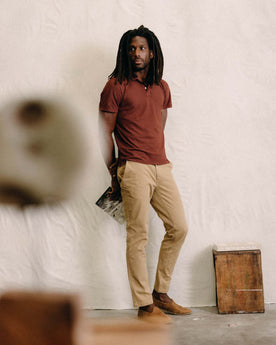 fit model standing wearing The Slim Foundation Pant in Organic Khaki, Bottoms by Taylor Stitch