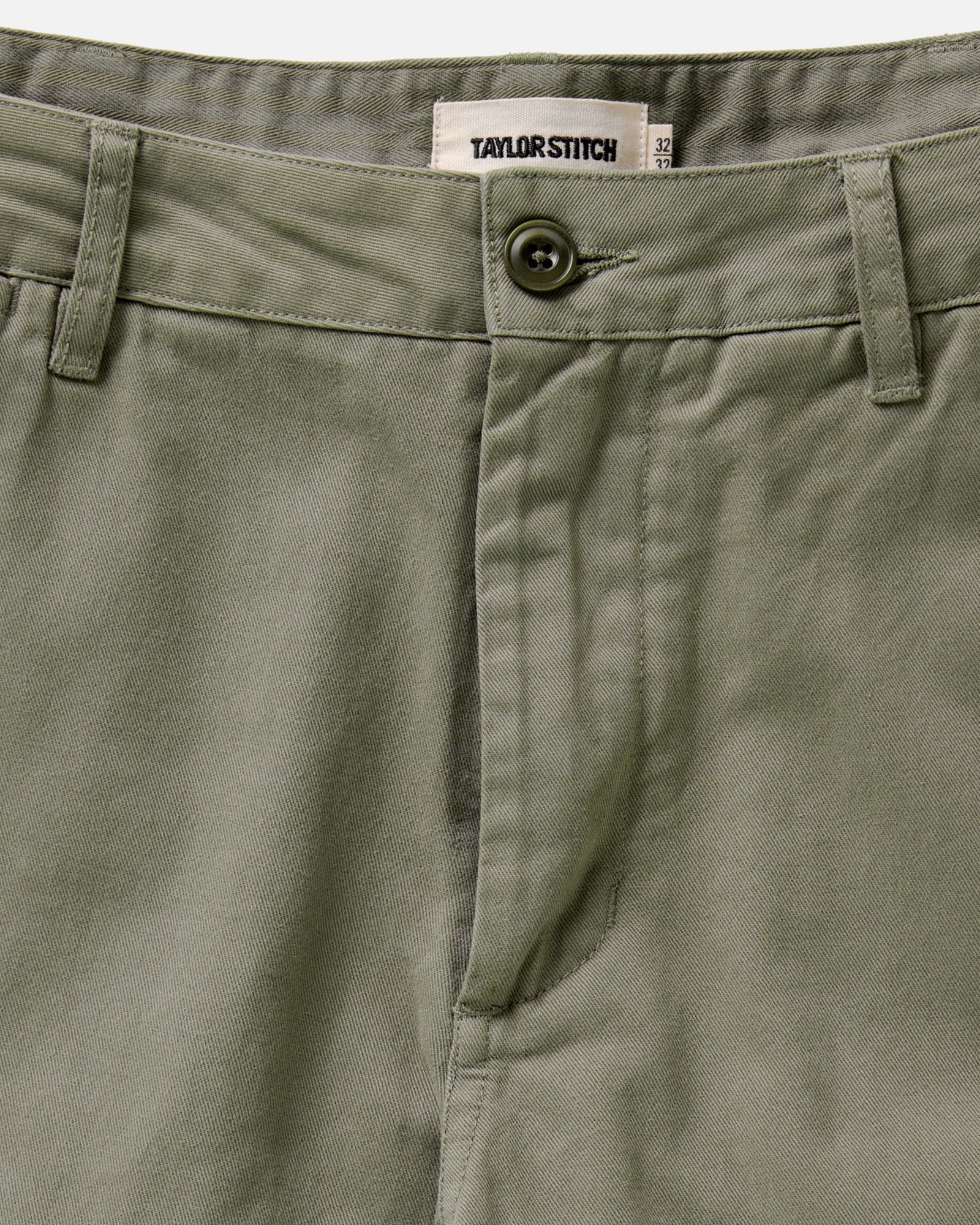 material shot of the waistband on The Slim Foundation Pant in Organic Smoked Olive, Bottoms by Taylor Stitch
