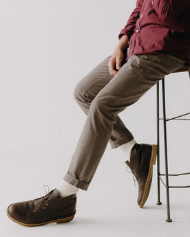 fit model posing in The Slim Foundation Pant in Organic Espresso, Bottoms by Taylor Stitch