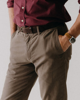 fit model with his hand in the pocket of The Slim Foundation Pant in Organic Espresso, Bottoms by Taylor Stitch