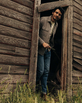 fit model walking wearing The Slim Jean in Mid Wash Organic Selvedge, Bottoms by Taylor Stitch