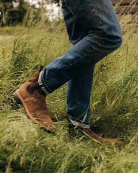fit model walking in The Slim Jean in Mid Wash Organic Selvedge, Bottoms by Taylor Stitch