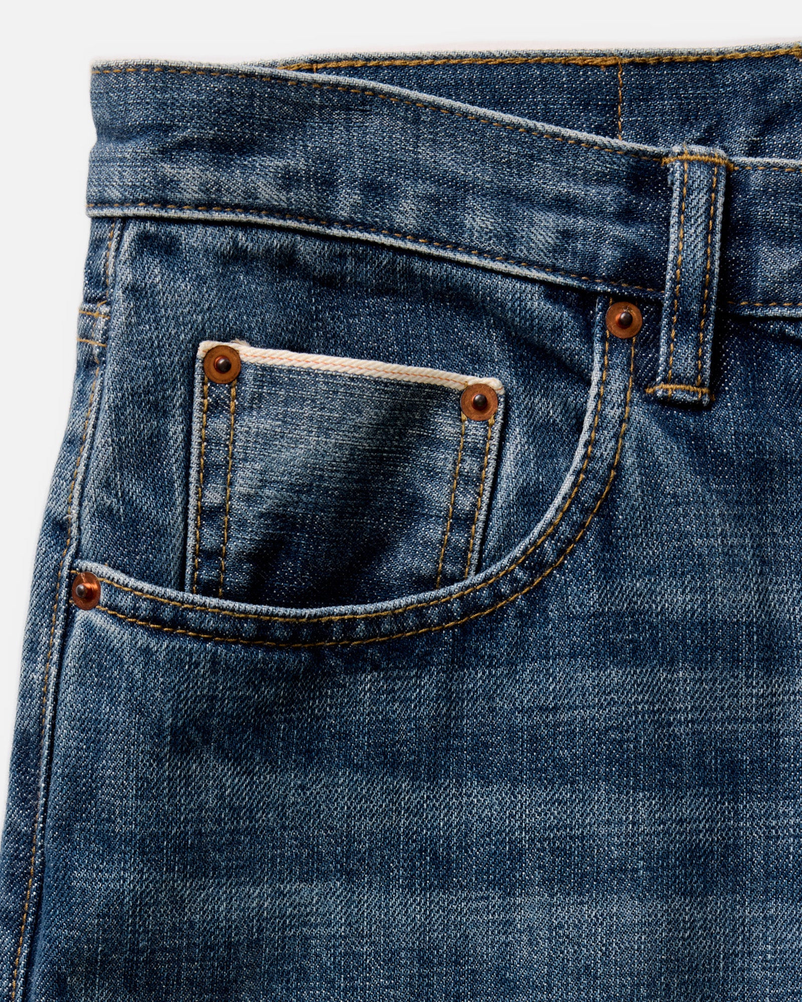 material shot of the waistband on The Slim Jean in Mid Wash Organic Selvedge, Bottoms by Taylor Stitch
