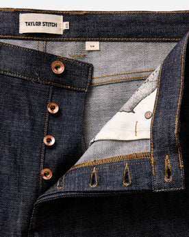 material shot of the button fly on The Slim Jean in Rigid Organic Selvedge, Bottoms by Taylor Stitch