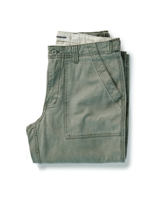 folded flatlay of The Surplus Pant in Field Olive Reverse Sateen