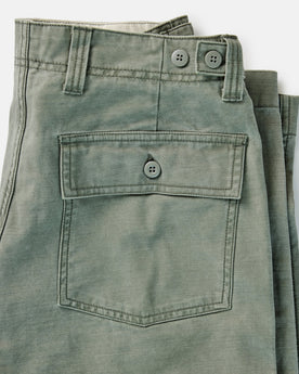 material shot of the zipper fly on The Surplus Pant in Field Olive Reverse Sateen, Bottoms by Taylor Stitch